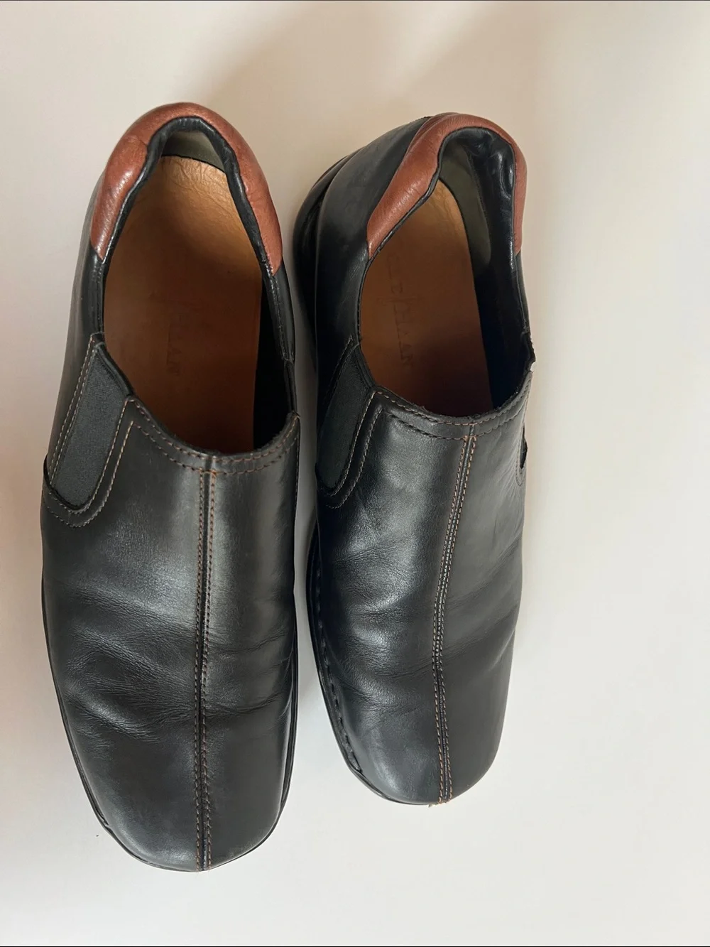 Cole Haan Black Leather Slip-On Loafers with Brown Heel Detail